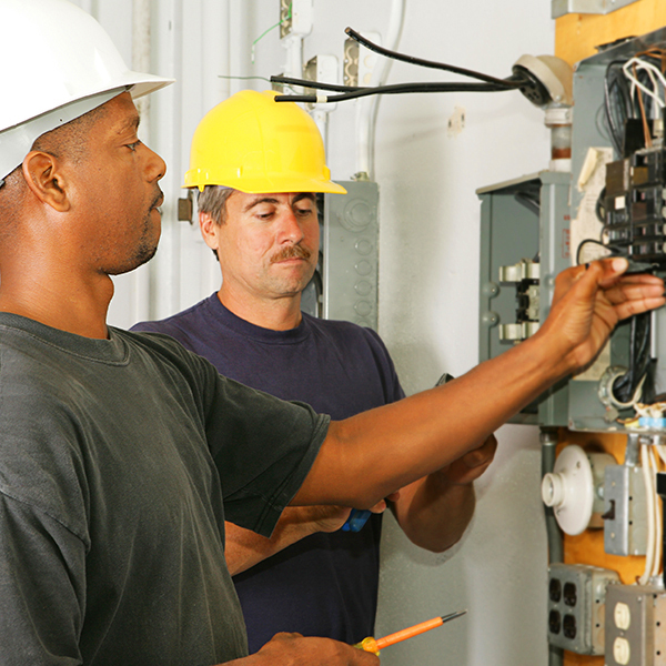 Help electricians by performing duties requiring less skill