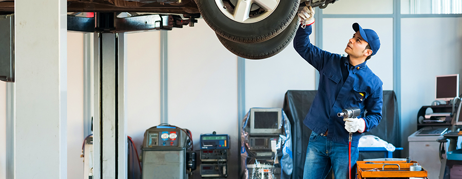 Mechanic performing basic care and maintenance