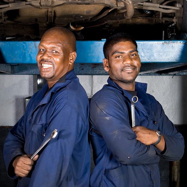 Mechanics ready to repair and maintain diesel engines on bus