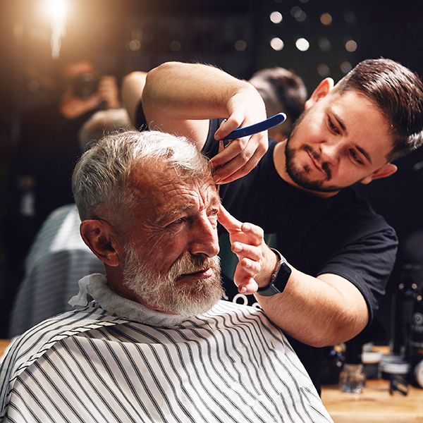 Cosmetologist applying make-up according to the requests of the client