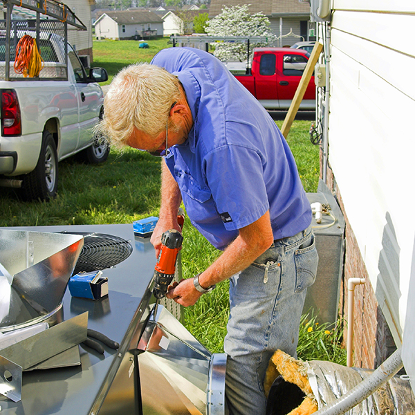 AC Repair Man working on an unit